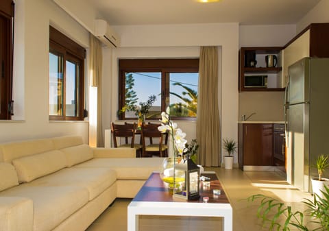 Family Suite, 3 Bedrooms, Poolside | Living area | 40-inch LED TV with satellite channels, TV, books