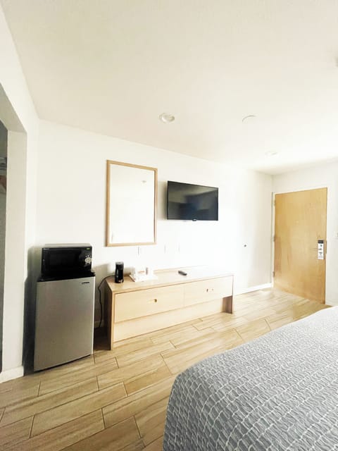 Desk, laptop workspace, blackout drapes, iron/ironing board