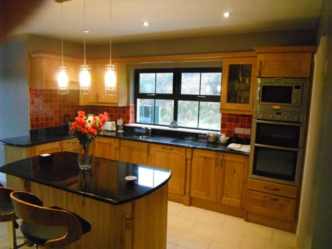 Kitchen with large utility room to the right.
Marble Kitchen countertops