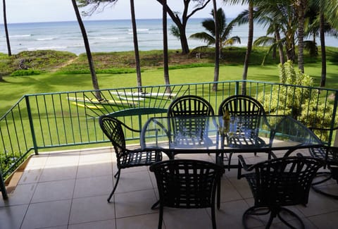 Covered outdoor eating area, with more seating to the left.  Fabulous wide view.