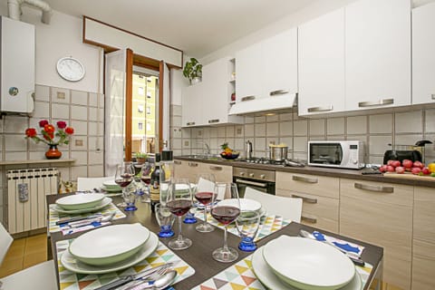The seperated kitchen with dining table