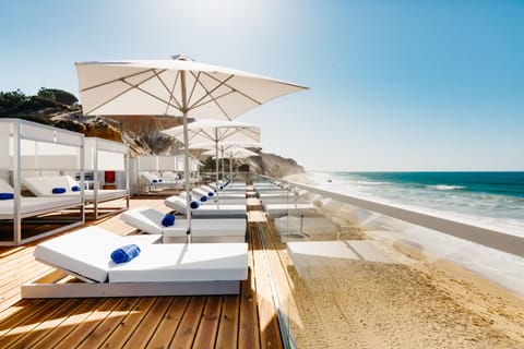 On the beach, sun loungers, beach umbrellas, beach towels