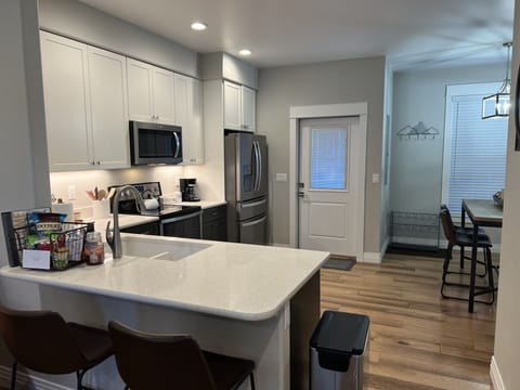 Counter height bar provides additional seating.