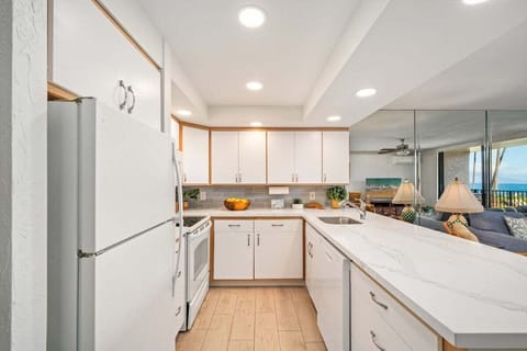 Full kitchen with granite countertops and views of the ocean