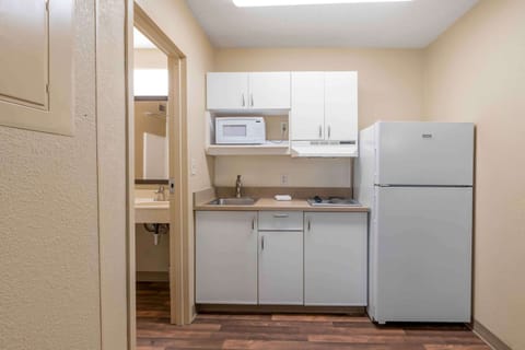 Studio, 1 Queen Bed, Non Smoking | Private kitchen | Fridge, microwave, stovetop, cookware/dishes/utensils
