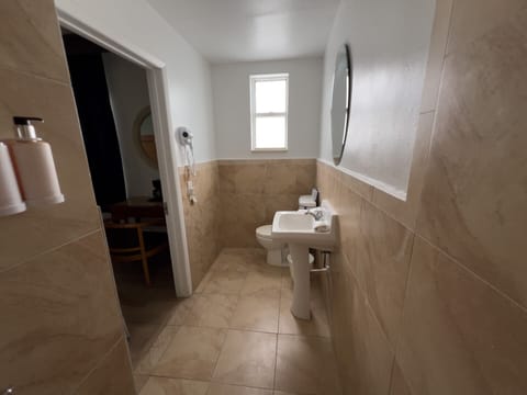 Standard Room, 1 King Bed, Accessible | Bathroom | Shower, designer toiletries, hair dryer, bathrobes