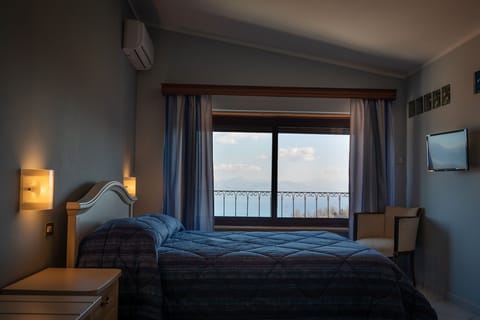 Panoramic Triple Room, Sea View | Minibar, desk, free WiFi, bed sheets