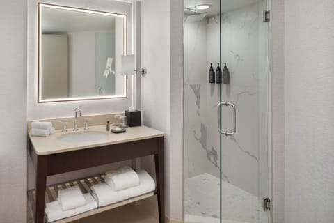 Designer toiletries, hair dryer, towels