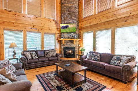 Living room with 20-ft. ceiling and gas of fireplace.