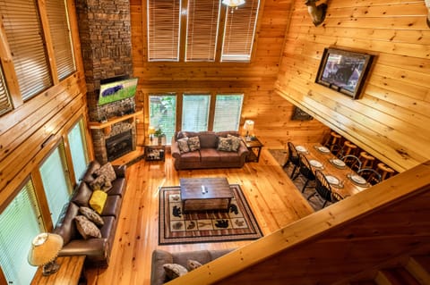 View from lofted game room into open living area with 20-ft. ceiling.