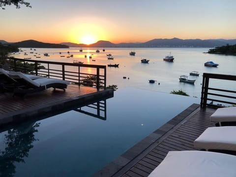 An infinity pool, sun loungers