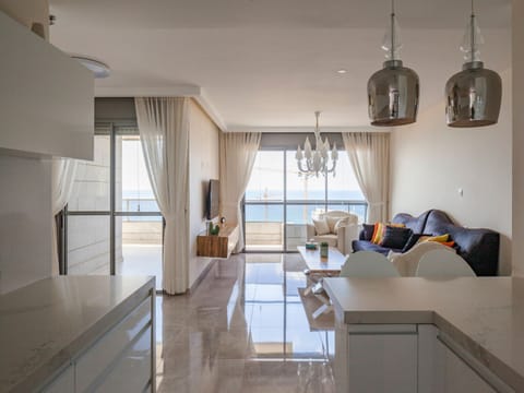 Luxury Apartment | Living area | 50-inch plasma TV with cable channels, TV