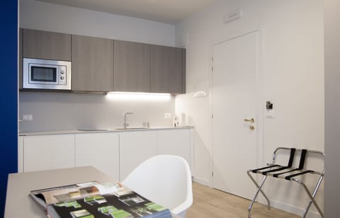 Fridge, stovetop, electric kettle, toaster