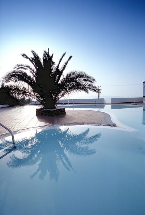 Seasonal outdoor pool, open 9:00 AM to 8:00 PM, free cabanas