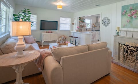 Living room and kitchen  are separated by a bar area
