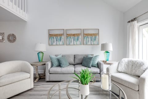 Spacious living room overlooking the back patio with a Smart TV.
