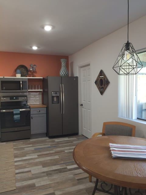 Kitchen, door next to refrigerator is laundry room.