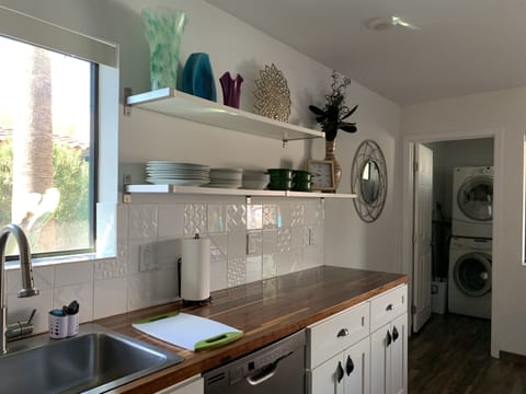 Kitchen with laundry room beyond.