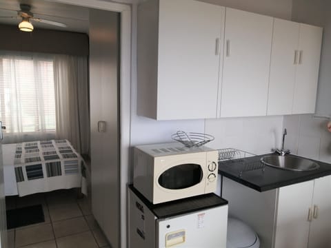 Oestervanger Self catering | Private kitchen | Mini-fridge, microwave, coffee/tea maker, toaster