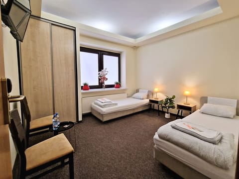 Standard Room, 2 Twin Beds, Shared Bathroom | Individually decorated, blackout drapes, iron/ironing board, free WiFi
