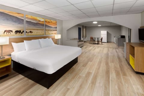 Room, 1 King Bed, Non Smoking (Efficiency) | Desk, iron/ironing board, free WiFi, bed sheets