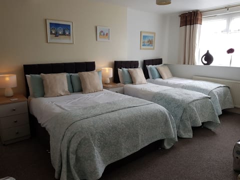 Family Room with Shower | In-room safe, iron/ironing board, free WiFi, bed sheets