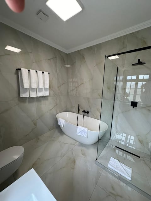 Designer toiletries, hair dryer, bathrobes, slippers