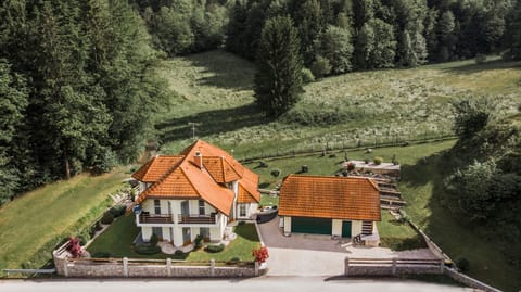 Villa at the end of the village surrounded by meadows and forests.