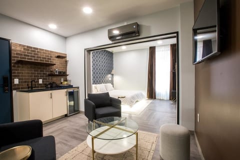 New Money King Suite Main St View | Living area | 40-inch LED TV with satellite channels, TV
