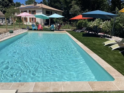 Seasonal outdoor pool, open 10:00 AM to 8:00 PM, pool umbrellas