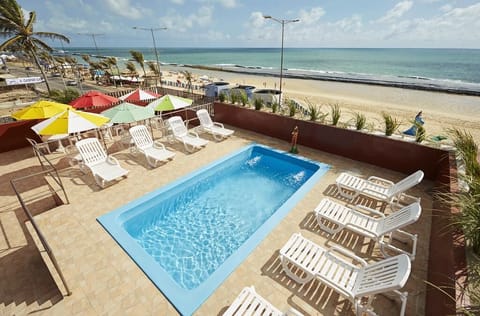 Outdoor pool, open 9:00 AM to 9:00 PM, pool umbrellas, sun loungers