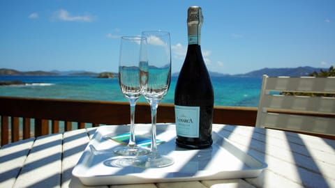 Enjoy your vacation with cold bubbly overlooking the vast of blue!