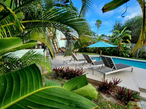 Rest and relaxation in your own eden of Cocoa Beach! Heated pool, rooftop deck!