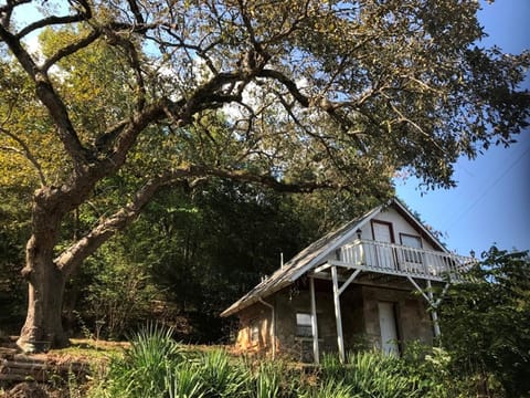 Cabin 1 includes a private patio and private upstairs balcony.
