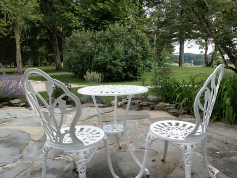 Stone patio overlooking the golf course and Kennebunk River.