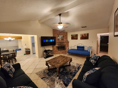 Living Room - 72" TV, 2 pull out couches and a day bed.