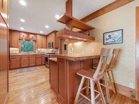 Kitchen with granite countertops and updated appliances.