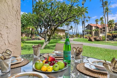 Dine outdoors with fresh fruit and garden views.