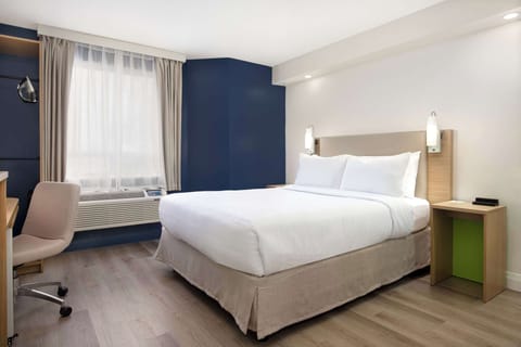 Desk, laptop workspace, blackout drapes, iron/ironing board