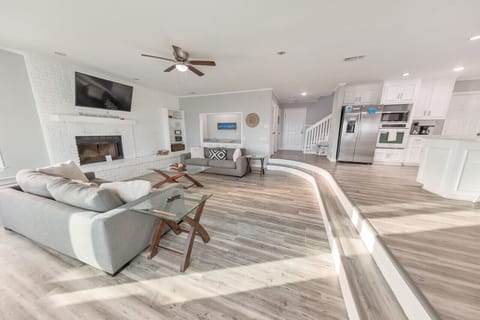 Cozy up in the living room with a fireplace and comfy seating.