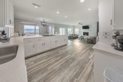 Fully equipped kitchen with ocean views and expansive counter space.