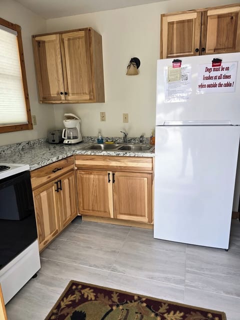 Kitchen has newly updated cabinets and countertops.