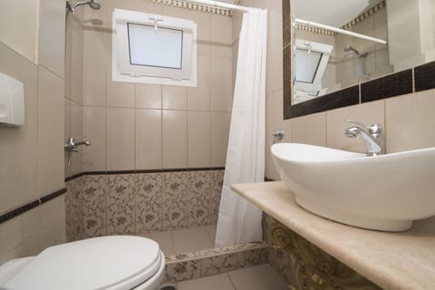 Shower, free toiletries, hair dryer, slippers