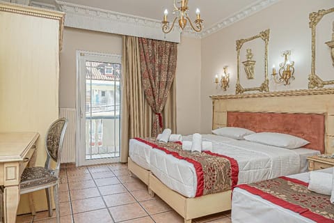 Superior Triple Room | Minibar, in-room safe, desk, soundproofing