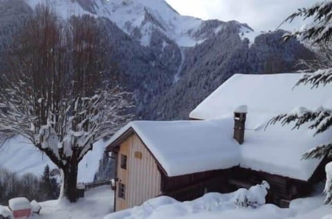 the charming chalet covered in snow