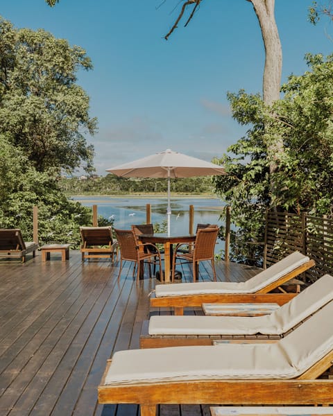 Seasonal outdoor pool, a waterfall pool, pool umbrellas, sun loungers