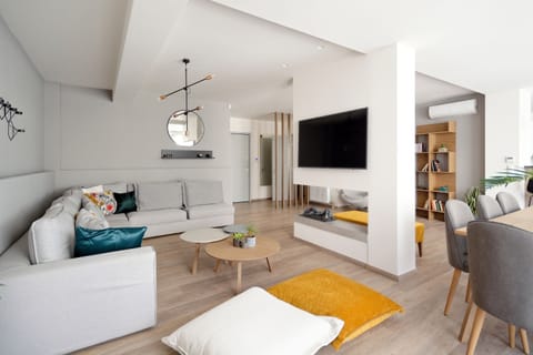 Deluxe Apartment, 4 Bedrooms, Balcony | Living room | Flat-screen TV, Netflix, streaming services