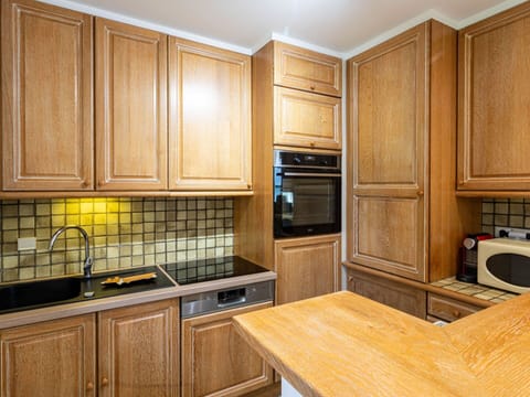 Kitchen, Cabinetry, Wood, Countertop, Flooring, Interior Design, Major Appliance, Floor, Kitchen Appliance, Cupboard
