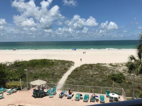 Walkway to the sandy beach & clear Gulf water