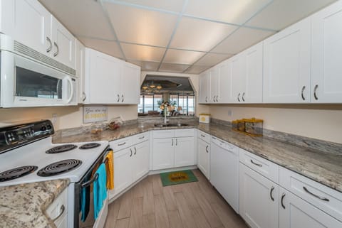 New kitchen also looks out  to the Gulf.  Prepare meals watching boats sail by.